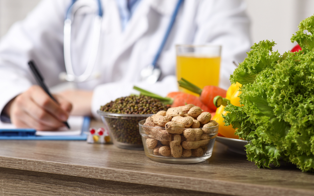 Nutritionist writing a healthy diet plan with fresh vegetables, nuts, and legumes on the table