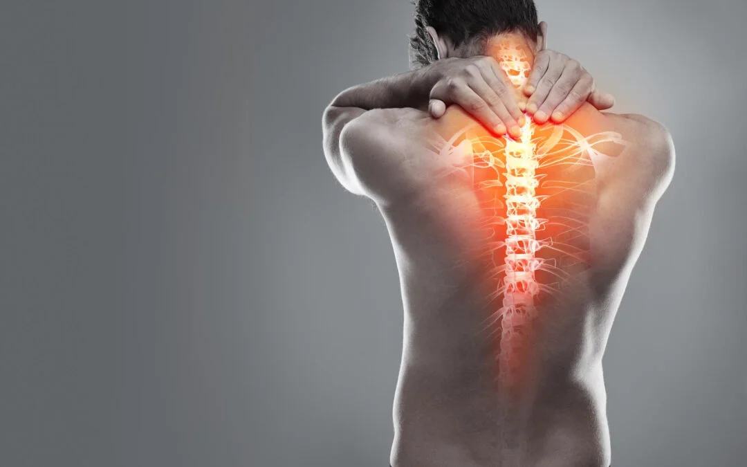 Male holding his neck and upper back in pain with highlighted spine illustration